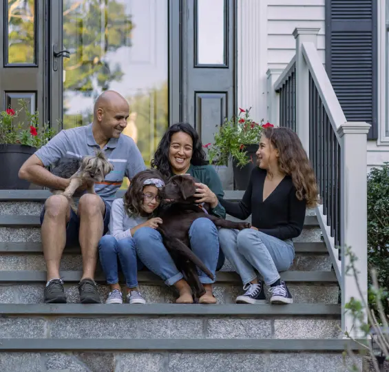 Family sitting on front porch